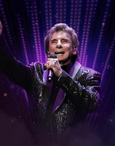 Barry Manilow’s Enduring Legacy Barry Manilow performing in a modern concert